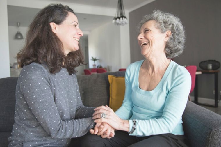 positive-elderly-woman-her-daughter-chatting-laughing