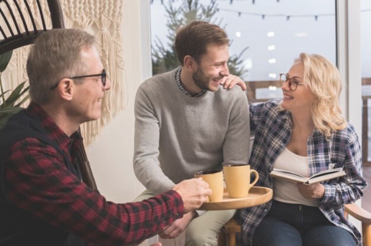 father-giving-mother-son-warm-cup